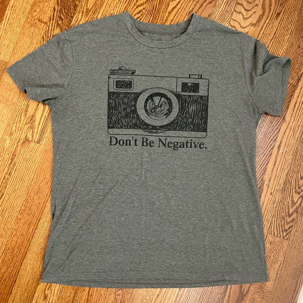 Grey “Don’t be negative” graphic t